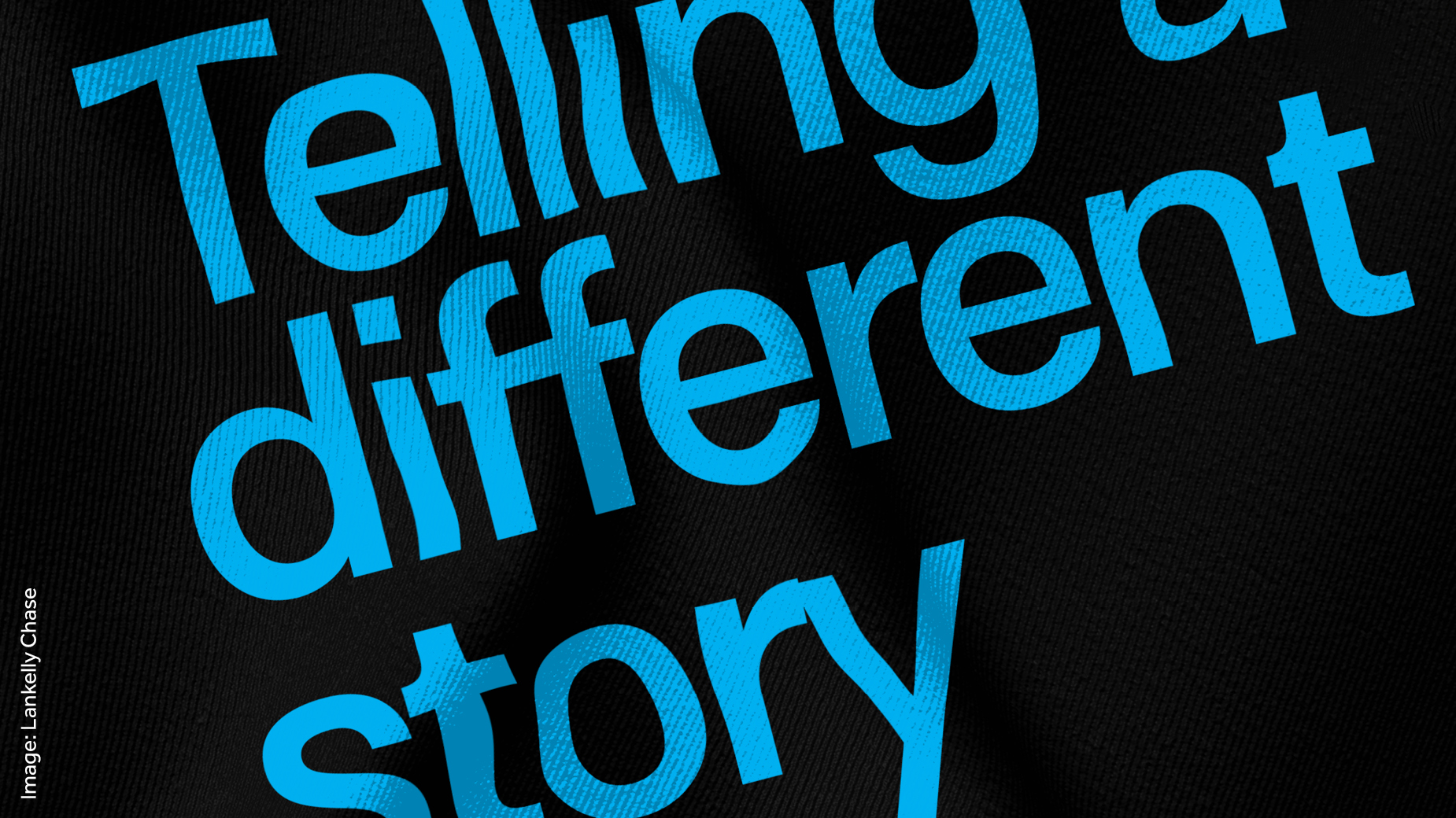 Blue font on a black background spelling out Telling a different story